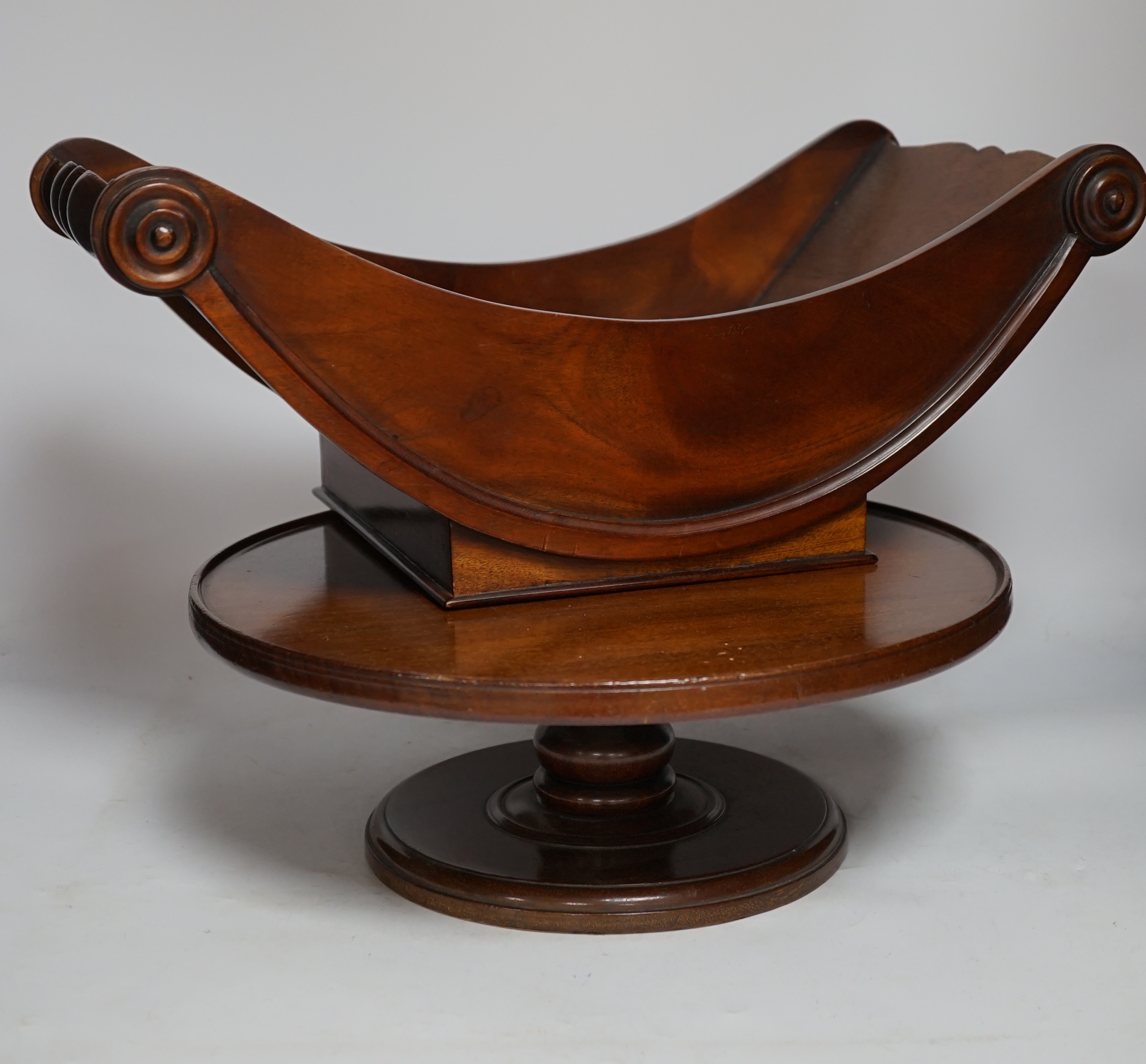 A large reproduction mahogany cheese coaster and a Lazy Susan, largest 50cm wide